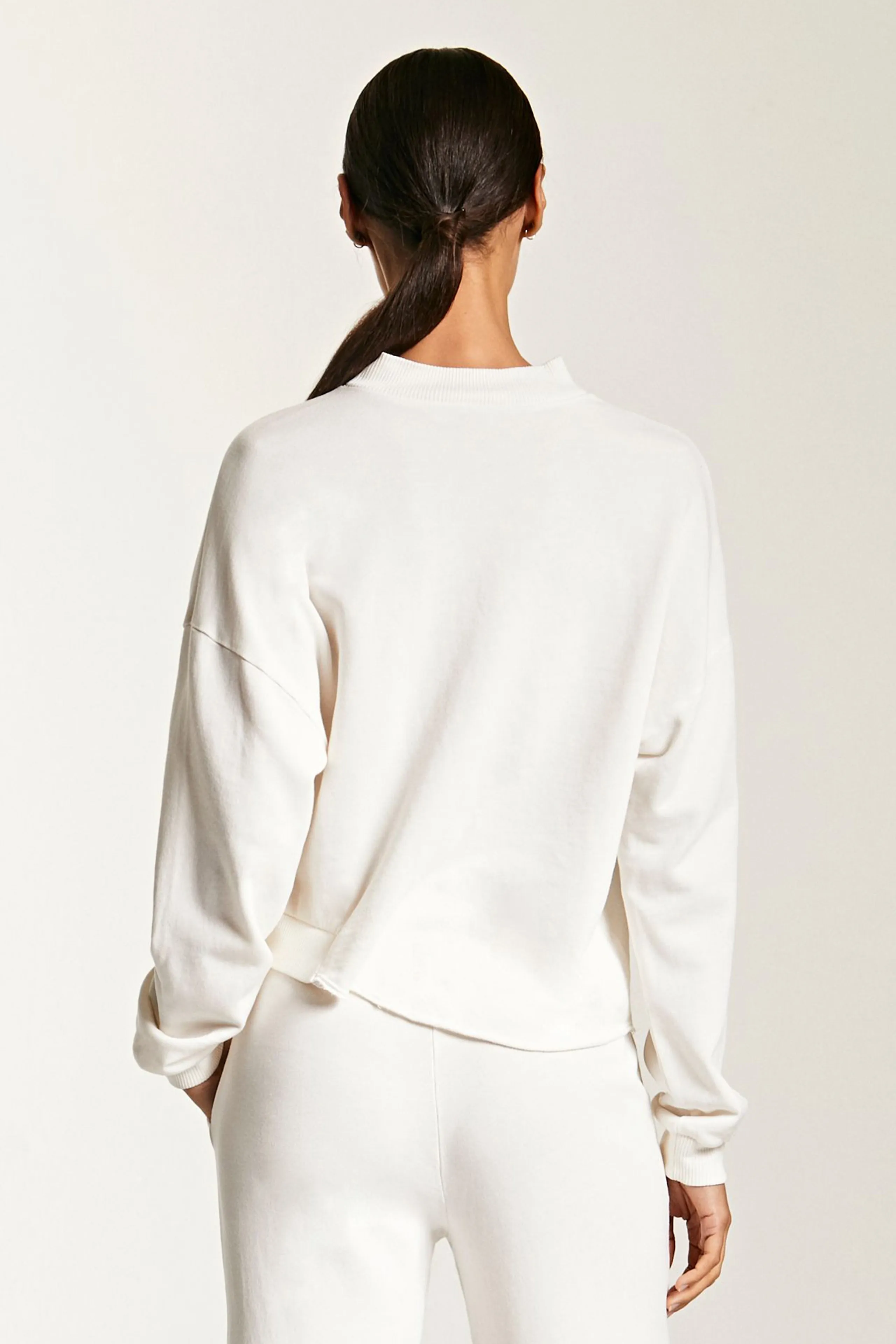 ASYMMETRICAL HEM TURTLENECK
